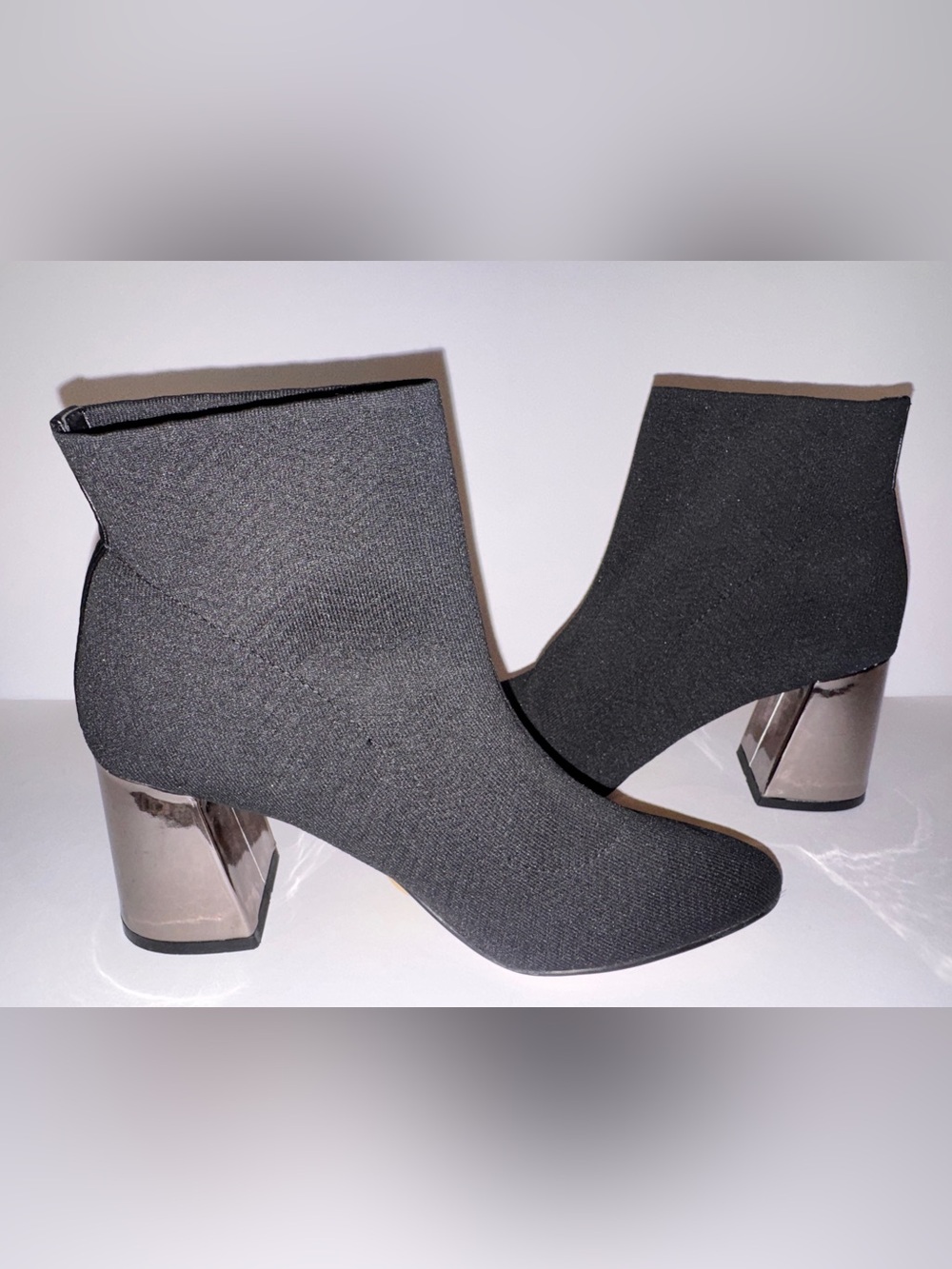 BCBGeneration “Conny” Black Stretch Fabric Ankle Boot w/Reflective Block Heel